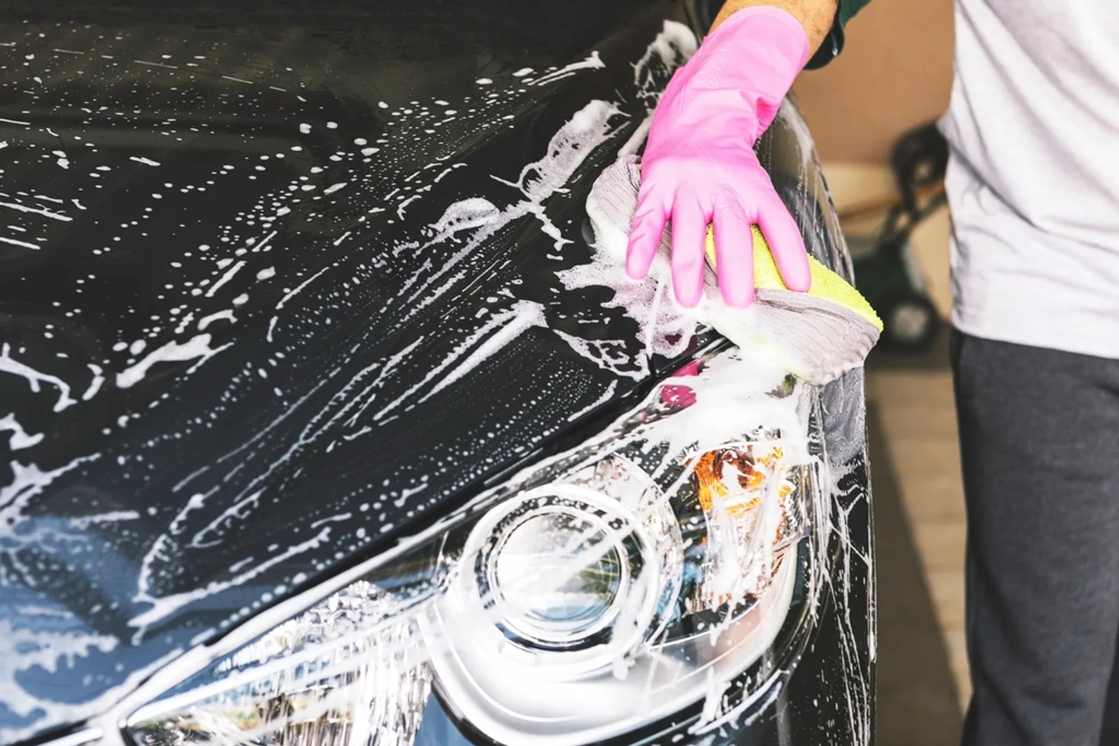 Soap foam on a car body during a wash